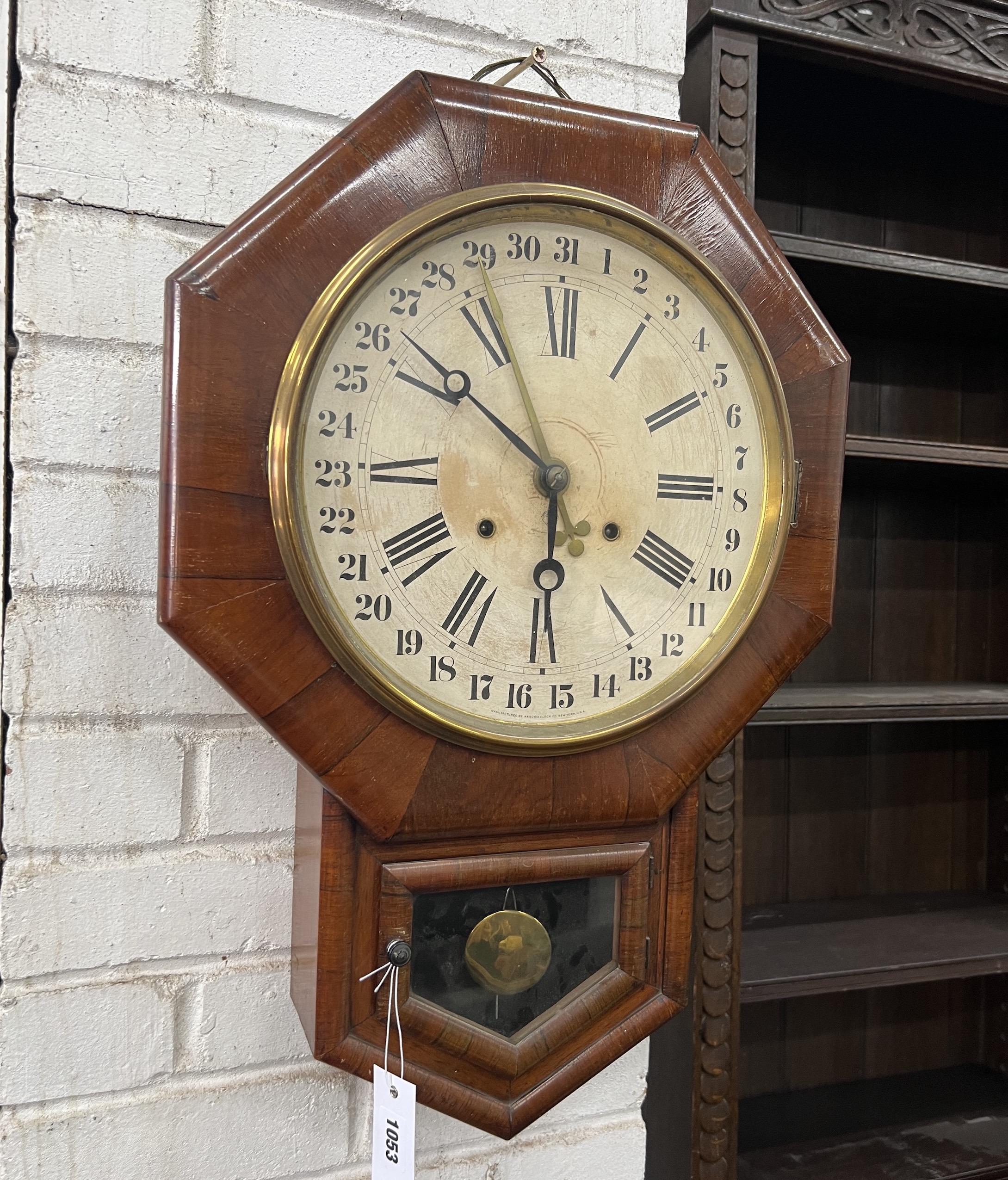 A late 19th century American rosewood drop dial wall timepiece with Arabic calendar dial, height 62cm